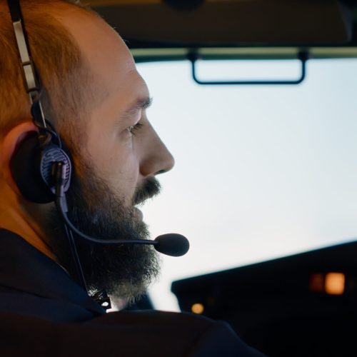 Male captain pilot flying airplane with dashboard command, using aerial navigation to takeoff. Control panel buttons with radar compass and windscreen, international flight service. Close up. SSUCv3H4sIAAAAAAAAA01Qu27DMAz8F842YPkZe+sHFOjQLehAS3QiVJEMSW4QGP730o+k1aQj745HzqAVdNDioOpGFukgsE3LZsD0VGeUtiLvJQ1lVSBCAgojQSeKIitOQjRlUVV1xi+BHoOW0M2gjZlC9Bi1s9Bxx5NV5LcvKR2d12gYLQmEiHEKFFjGSLL3hbsbfvqd57XOAT892jA6H3djFk89l9+0Hw1a1izJk/pBbjT0orzrIMmsJDf9p70IsHwlgBey8rEmWdbIhnALdoZalVUj2lOaSyzSMsuz9NQ2KsWiEbnqcxRqADb4vkfyt2MXF6/ryjzKTTb6xz7OODdiz9G6AU2gBK4YAhPUUWDh6LXU9nJchA/pbvvfurjm2VJHJ7+1OkbtR7xqrq5zZphG41CROtpTf9MxPqGnH033P/ayLL/xFLFIAgIAAA==